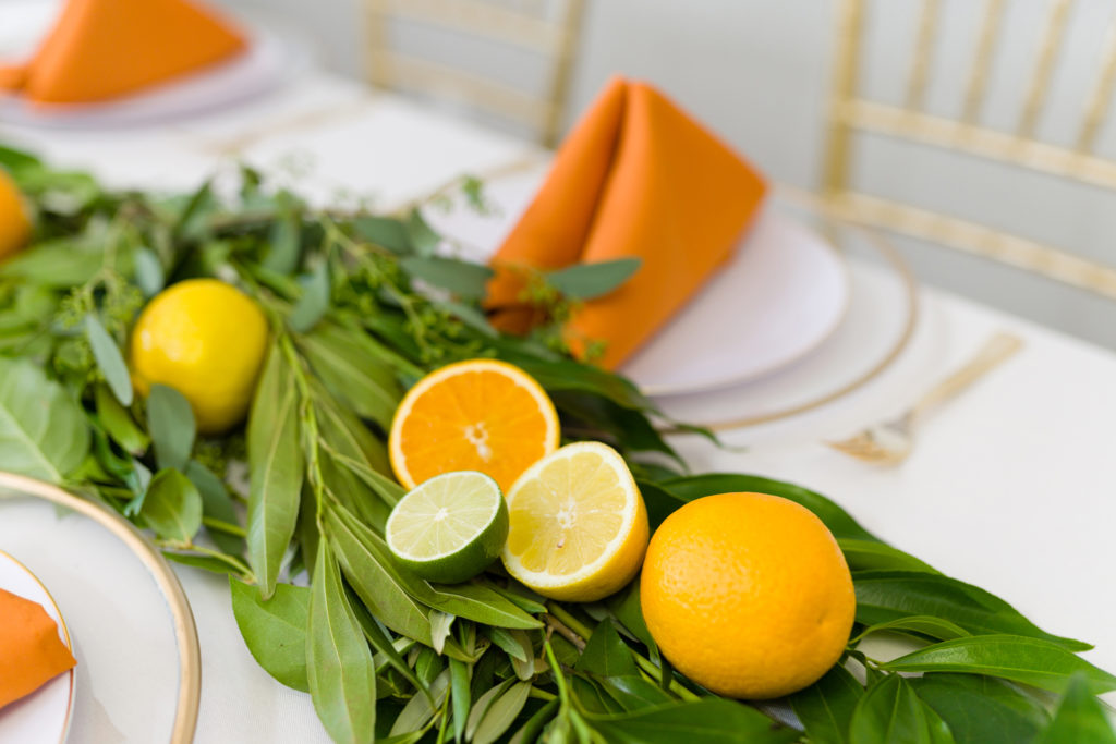 Mama's Main Squeeze Baby Shower theme with lemons, limes, orange folded napkins at Magical Moments Event Center captured by Freeze the Moment 4Ever Photography